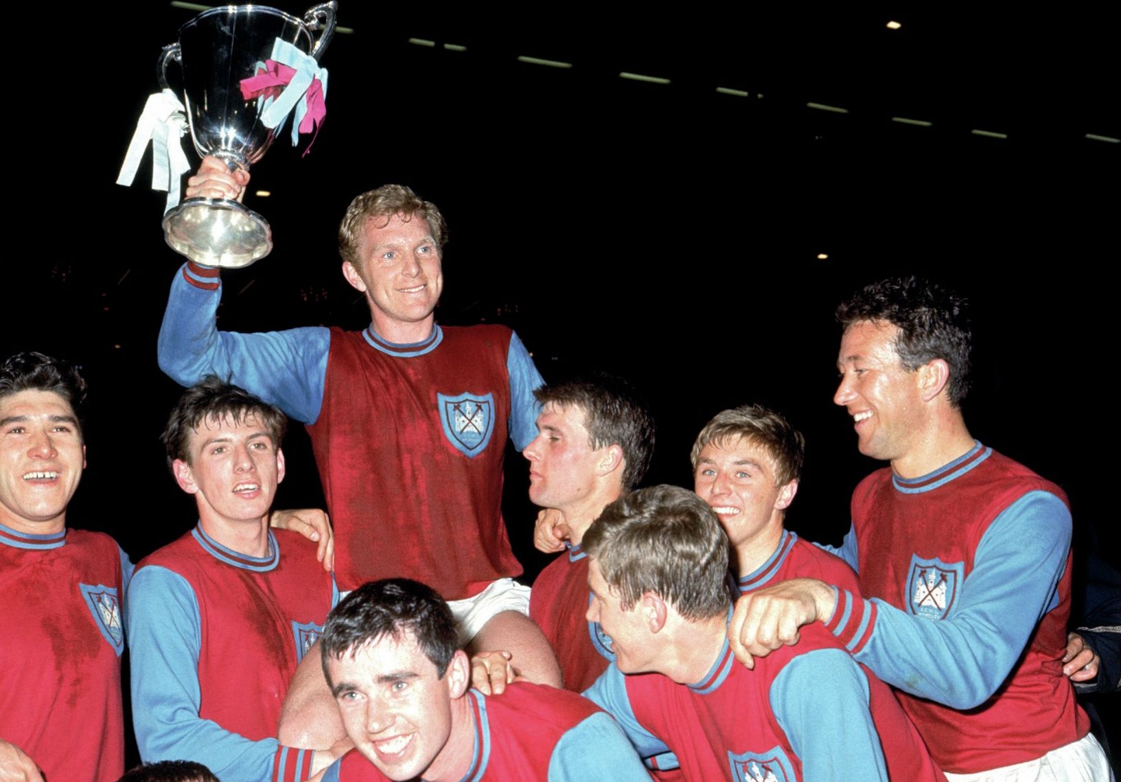 Bobby Moore shows off the trophy as West Ham celebrate