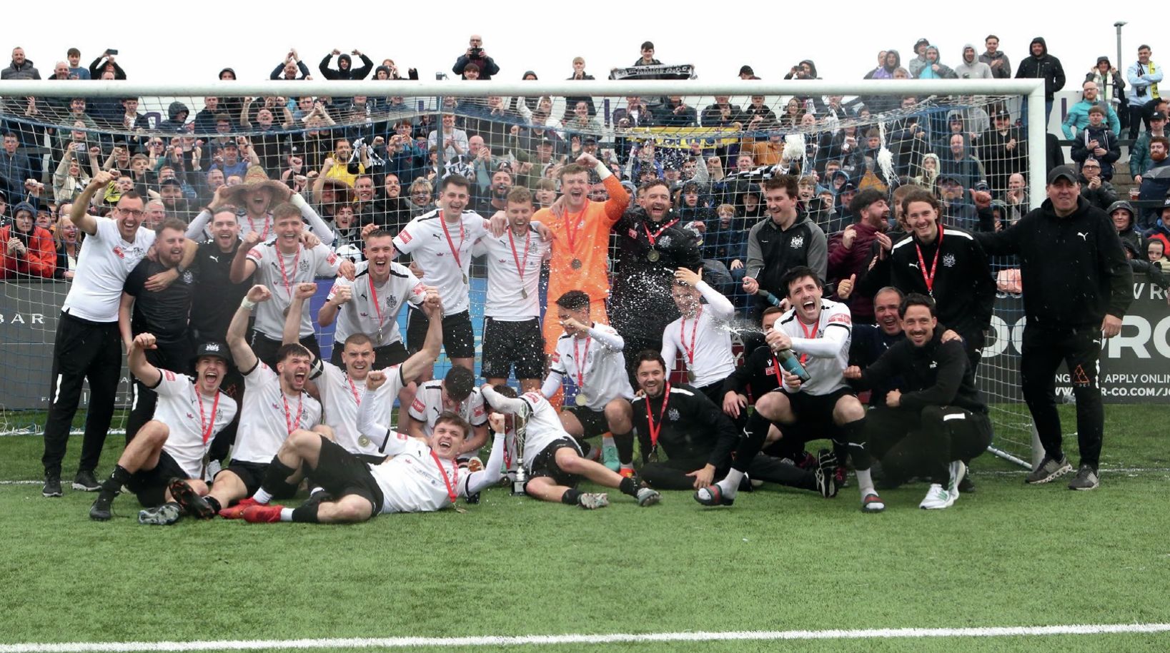 Marine players and fans celebrate promotion from the Northern Premier League last term